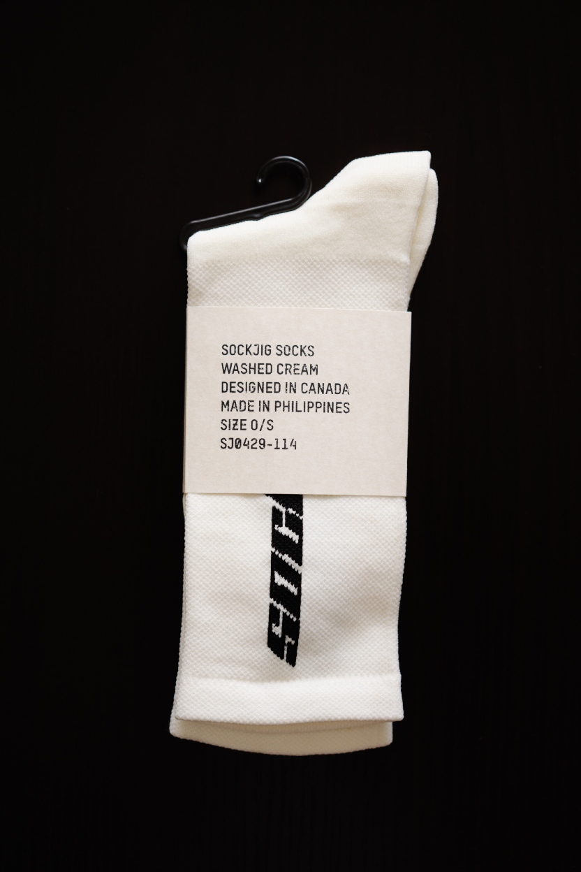 Sockjig Socks in packaging on dark table